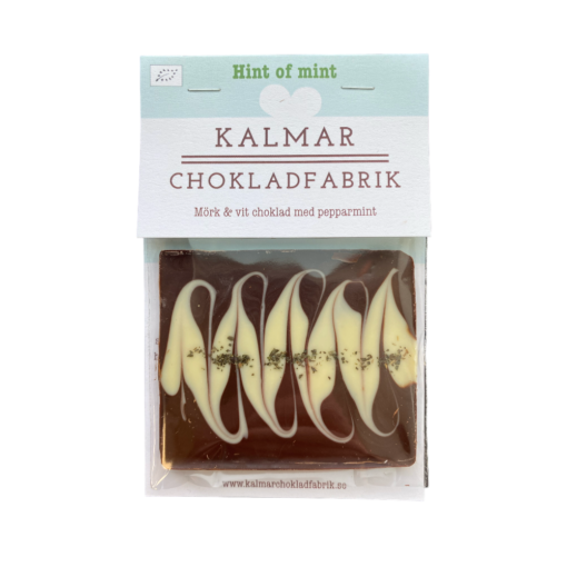 En bild som visar Mini Hint of mint - Handgjord och ekologisk minichokladkaka i mörk choklad 70% och vit choklad 38% med pepparmint tillverkad av Kalmar Chokladfabrik